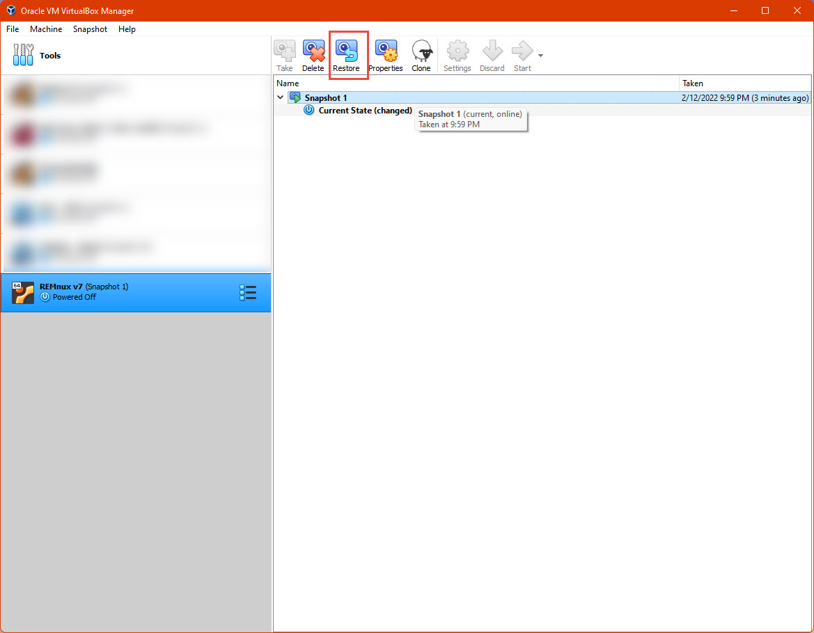 Screenshot of the VirtualBox window with the Restore button highlighted